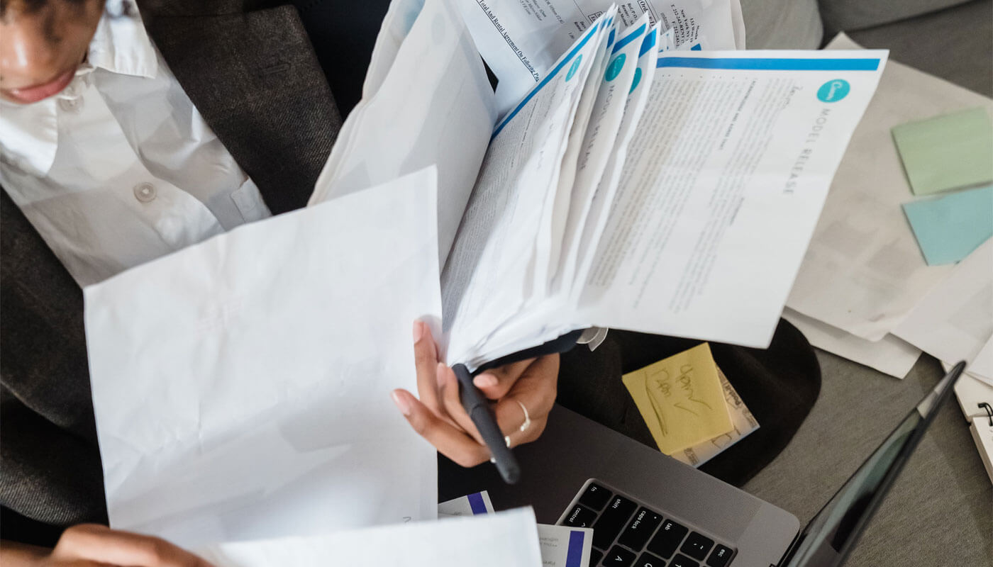 Independent contractor reviewing tax deductions and bookkeeping records.